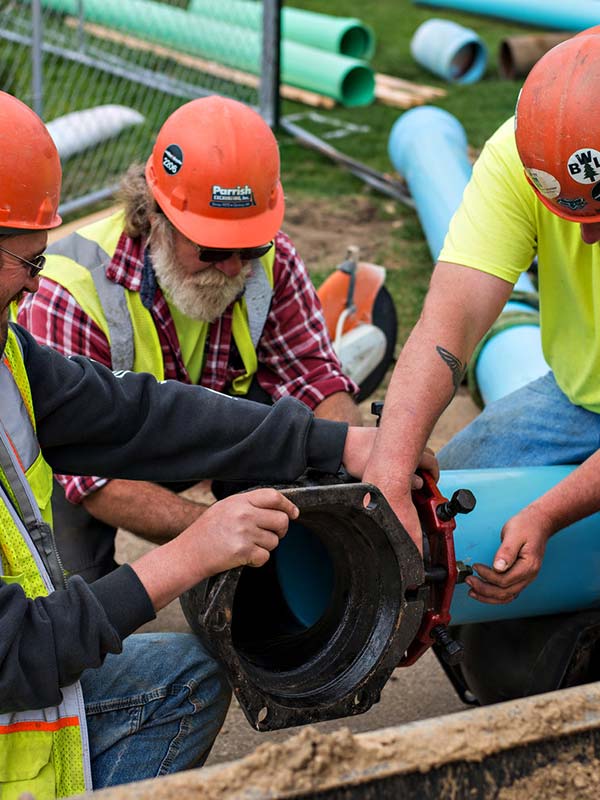 Professionals joining the pipe with machine